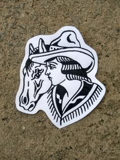 a white sticker with a horse wearing a cowboy hat on it's head