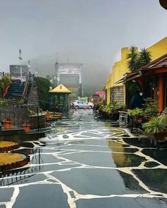 an empty street is shown in the rain