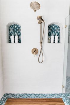 a shower head and hand shower in a bathroom