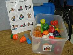 a plastic container filled with lots of colorful candies next to a sign that says things do well for kids