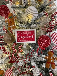 a christmas tree decorated with gingerbread ornaments and candy canes for the holiday season