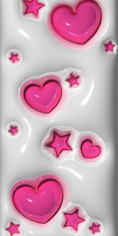 some pink hearts and stars on a white background