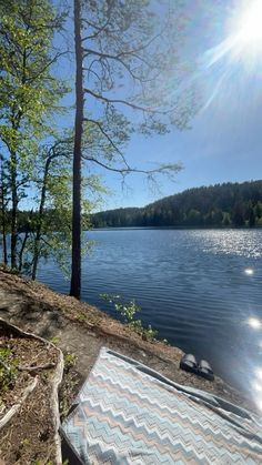 the sun shines brightly over a body of water