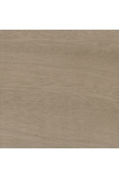 a close up view of the wood grains on this tile flooring material, which is light brown in color