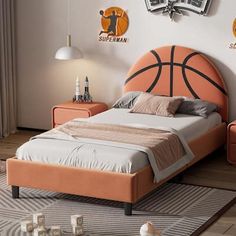 a bedroom with a basketball themed bed in it