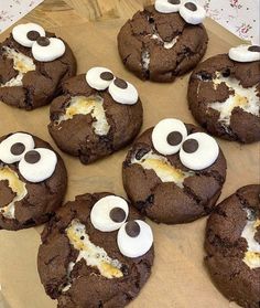 chocolate cookies with googly eyes and googly eyes on them are ready to be eaten