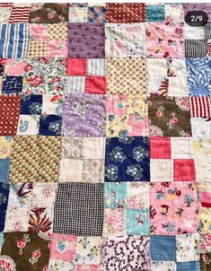 an old patchwork quilt with many different colors