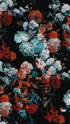 a bunch of flowers that are on the ground in front of a black background with red, white and blue flowers