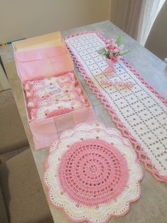 crocheted doily and table runneres on a table