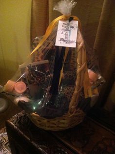 a basket filled with candles and wrapped in plastic