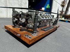 a car engine on display in front of a building