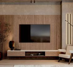 a living room with a large flat screen tv mounted on the side of it's wall