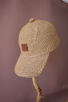 the hat is made out of straw and has a leather patch on it's brim