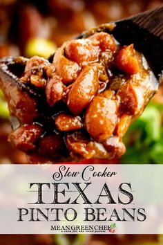 a spoon full of beans and broccoli with the words slow cooker texas pinto beans