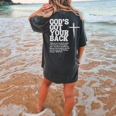 Isaiah Shirt, Comfort Colors God's Got Your Back Shirt, Christian Shirt, Jesus T-Shirt, Bible Verse Tee, Isaiah 43, Christian tshirts women GOD'S GOT YOUR BACK ❤ When you pass through the waters, I will be with you; and through the rivers, they shall not overwhelm you; when you walk through fire you shall not be burned, and the flame shall not consume you. PLEASE NOTE THIS IS A BACK PRINT DESIGN ONLY. THE FRONT IS PLAIN ❤️ ✦ FEATURES ✦ ✿  What makes these t-shirts so special? Well, there's an ar Cool Christian Tshirts, Cross Tshirt Designs, Godly Shirts, Christian T Shirt Ideas, Scripture Clothing, Jesus T Shirts, Christmas Sweatshirt Ideas, Walk Through Fire, Christian Shirts For Women