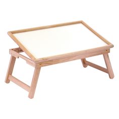 a wooden table with a white board on top