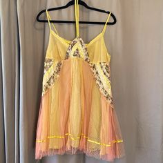 This Paneled Dress (Or Top) Is Something Out Of A Fairytale. It Has A Yellow Slip Underneath With A Pink Lemonade Mesh On Top. Patterned Details (See Photo) With Beading And Floral Fabric On Front. Ties Around The Neck. Very Short! Could Be Worn As Nightgown, Or Even A Top. Yellow Summer Sleep Dress, Spring Party Lace Nightgown, Bohemian Yellow Mini Dress For Party, Bohemian Lace Trim Summer Nightgown, Yellow Lace Mini Dress For Summer, Bohemian Summer Nightgown With Lace Trim, Yellow Summer Nightgown For Sleep, Yellow Summer Nightgown, Fitted Nightgown For Summer Parties