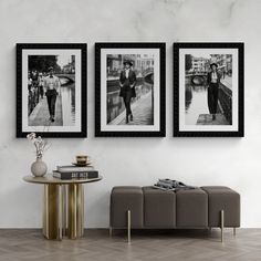 three black and white photographs hanging on the wall