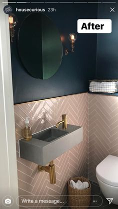 a white toilet sitting next to a sink in a bathroom under a mirror above it