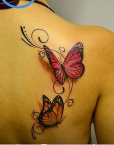 a woman's back with two butterflies on it