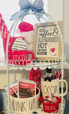 a white basket filled with lots of different types of coffee mugs and other items