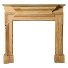 an old fashioned fireplace mantel with wood trimmings on the top and bottom