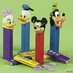 mickey mouse, goofy duck and donald duck on top of candy bars