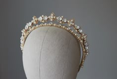 Wedding crown with pearls and crystals. Bridal pearl gold tiara. The crown on photo with ivory pearls. Available also with white pearls, please see in menu ~MATERIALS~ -Austrian crystals (color White clear) -Czech glass pearl beads -Gold tone filigree ~SIZE~ Center height  1 inch ~SHIPPING AND DELIVERY TIME~ This headpiece is ready to ship by 3-5 days The approximate time of shipment: - 10-16 days to Europe - 15-35 days to United States and other countries. ~IMPORTANT INFORMATION~ -Please allow Bridal Gold Tiara, Wedding Kokoshnik, Wedding Halo Headpiece, Kokoshnik Tiara, Pearl Tiara Wedding, Pearl Crown, Wedding Halo, Crystal Bridal Tiaras, Crown Gold