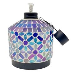 a blue and purple mosaic glass lantern hanging from a black metal chain on an isolated white background