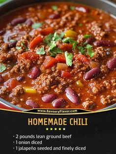 a bowl filled with chili and beans on top of a table