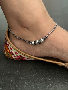 A beautiful pair of anklets handcrafted in brass and antique polish. Hook Closure  Weight: 30 grams per pair  Length of Anklets: 10 inches. Handmade Toe Ring Anklets For Festivals, Bohemian Oxidized Anklets With Adjustable Fit, Adjustable Metal Anklets For Festivals, Bohemian Oxidized Adjustable Anklets, Traditional Metal Anklets For Gift, Traditional Metal Anklets As Gift, Bohemian Oxidized Finish Adjustable Anklets, Bohemian Anklets With Oxidized Finish As A Gift, Bohemian Oxidized Finish Anklets As Gift