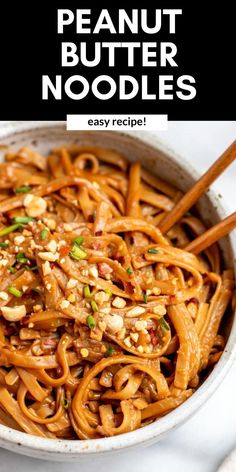 peanut butter noodles in a bowl with chopsticks