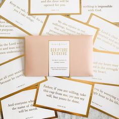 a pile of cards with gold foil on them