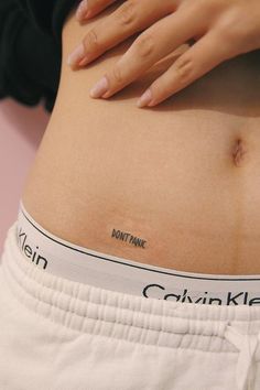 a woman's stomach with her hand on her hip and the words mountain time written on it