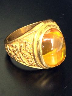 This is a perfect and unique style magic ring made of yellow naga eye stone and raw brass metal, the power is the protection in all kind of dangers and brings the rich and luck wealth to the wearer, it is great to get this ring for your loved one or treat yourself for a classic timeless style. Ring US Size: 10, Stone Type: Pink naga eye stone Metal Type: Raw Brass Weight: 29.70 Gram (Approx.) Thanks so much for visit and help support. Collectible Gold Opal Gemstone Ring, Vintage Gold Opal Cabochon Ring, Collectible Gold Opal Ring With Gemstone, Spiritual Gold Rings With Gemstone, Antique Gold Opal Ring Collectible, Antique Gold Citrine Jewelry, Antique Citrine Gold Jewelry, Vintage Gold Opal Ring Gift, Vintage Gold Opal Ring For Gift