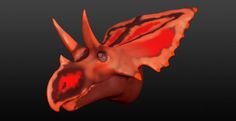 an orange and red dragon head with large wings on it's back end, against a black background