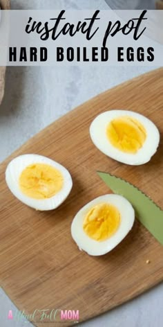 hard boiled eggs cut in half on a cutting board with the words instant pot hard boiled eggs