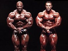 two men standing next to each other in front of a black background with the words bodybuilding