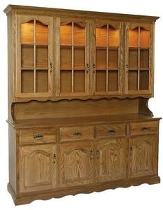 a wooden china cabinet with glass doors on the top and bottom, sitting against a white background