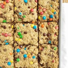 cookies with m & m and chocolate chips are arranged on top of eachother