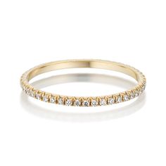 a yellow gold band with white diamonds