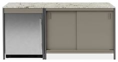 an image of a kitchen cabinet with granite counter top and stainless steel doors on both sides