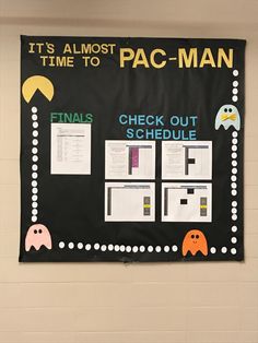 a bulletin board with pac - man on it in a school gym room that says, it's almost time to pac - man check out schedule