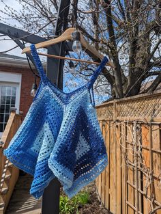 Handmade Crochet Kanata Kerchief Tank - Perfect for Springtime Chic Description: Step into spring with style in our handmade crochet Kanata Kerchief Tank! This charming and versatile top is the perfect addition to your warm-weather wardrobe, offering a blend of bohemian flair and contemporary chic. Crafted with care and attention to detail, each tank features a flattering kerchief hemline and intricate crochet detailing that adds texture and visual interest. The lightweight and breathable design Handmade Bohemian Blue Tops, Kanata Kerchief Tank, Intricate Crochet, Crochet Tank, Contemporary Chic, Womens Tank Tops, Crochet Details, Spring Wardrobe, Favorite Jeans