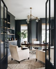 a living room filled with furniture and a chandelier