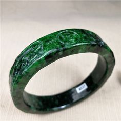 62mm Ancient Myanmar Natural Ice Green Jadeite Hand-Carved Jade Bracelet Bangle ( Product 100% more beautiful than pictures! )                    Natural jade jewelry, each one is unique baby. You like, please don't wait. Size: Inside: 62mm wide and thickness: 15 x 8mm  ( 1 inches=25.4mm ) Weight : 68.50g Shape : Bracelet. Material : Jadeite jade  Grade : Jadeite Jade Bangle  Origin:Only in myitkyina in northern  gem grade emerald mining area. Refractive Index : 1.66~1.67 . Specific Gravity : 3.33~3.34 . Jadeite Color :  As shown in figure .             Luster: Glassy luster. Surface Texture: Medium grain.    Condition:  As picture. Accessory: box. Jade jadeite, or "yu" "玉"in Chinese is also known as the "Stone of Heaven". Comes in many fine nuances of green, but also in shades of white, b Texture Medium, Carved Jade, Jade Bangle, Jade Bracelet, Jade Carving, Jade Jewelry, Natural Jade, Shades Of White, Bracelet Bangle