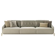 a beige couch with pillows on it