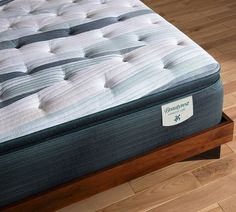 an image of a mattress that is on the bed in the room with wood flooring