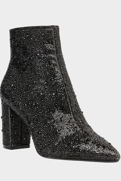 The Cady Boot is a disco-ready bootie that will take any outfit you wear to the next level. These ankle boots feature a pointed toe and a study, block heel and are fully decked out with rhinestones. Glitz and glam have never looked better. Run true to size Rhinestone dress Side zipper closure Textile lining Iconic blue sole 3.5 inch heel height 5.5 inch shaft height Blue By Betsey Johnson, Sparkly Party, Dress Booties, Black Block Heels, Betsey Johnson Shoes, Dressy Fashion, Block Heel Ankle Boots, Glitz And Glam, Black Rhinestone