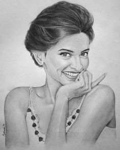 a pencil drawing of a smiling woman with her hand on her chin and looking at the camera